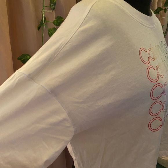 large and lose fitting, multi colored words but plain white shirt, very cute! - Picture 2 of 5